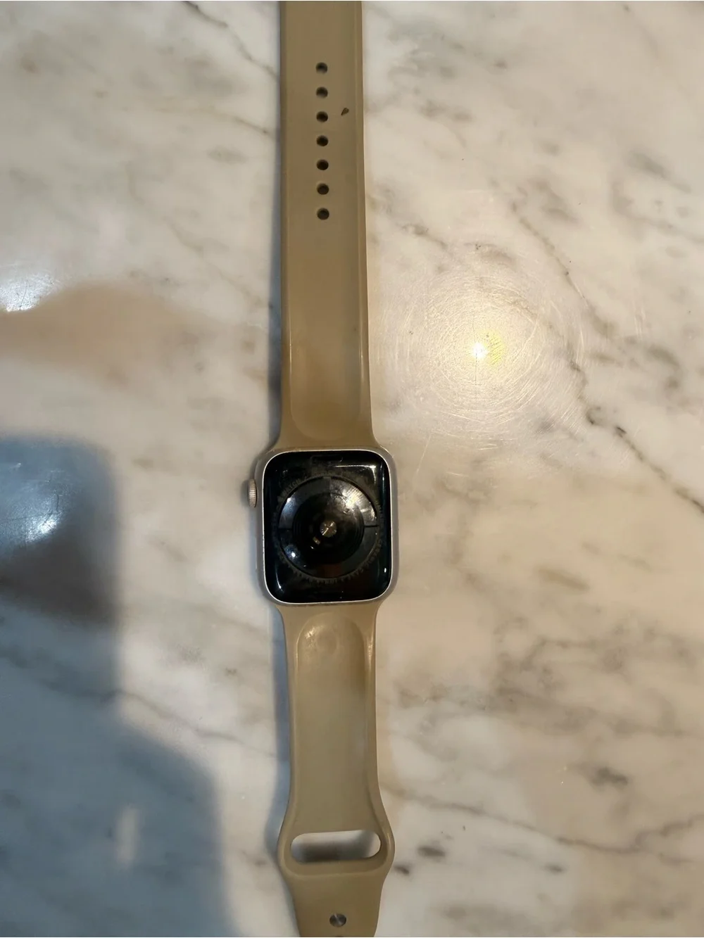 Apple Watch with Beige Silicone Band and Silver Case